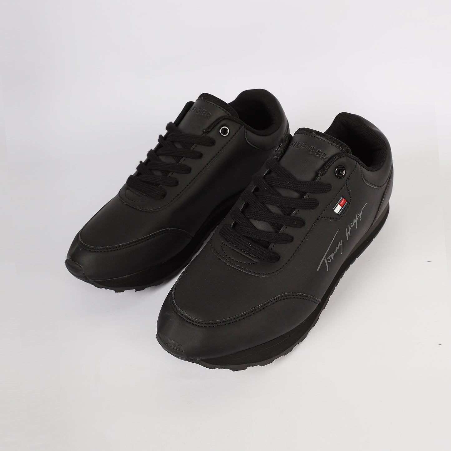 Flag Leather Sneaker" by Tommy Hilfiger. Black