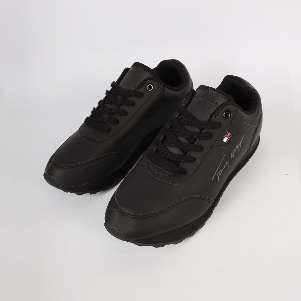 Flag Leather Sneaker" by Tommy Hilfiger. Black