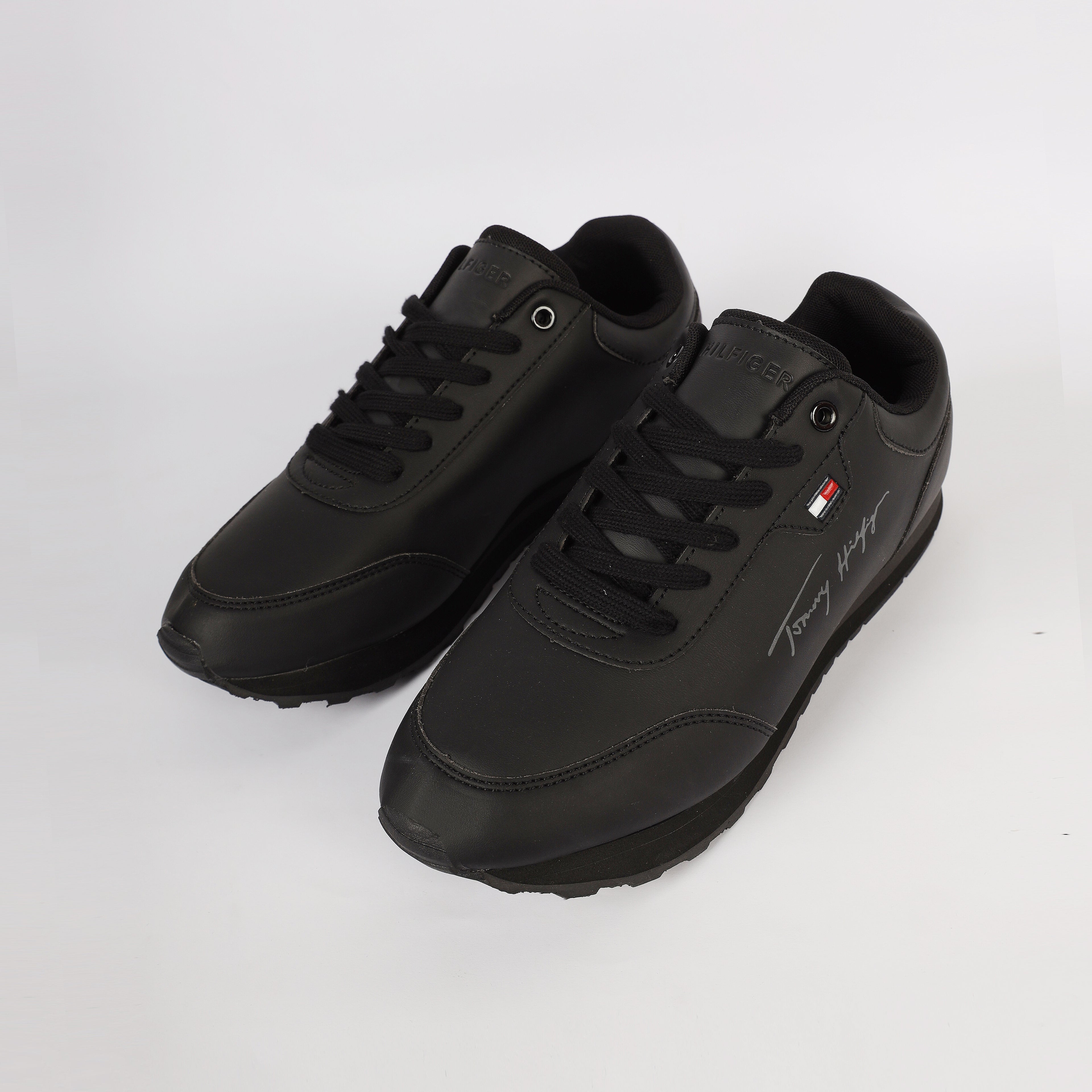 Flag Leather Sneaker" by Tommy Hilfiger. Black