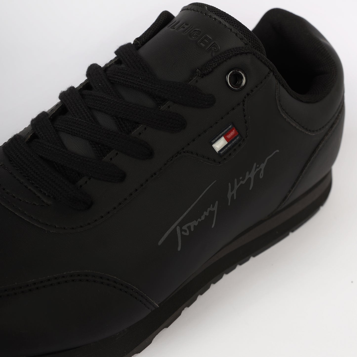 Flag Leather Sneaker" by Tommy Hilfiger. Black