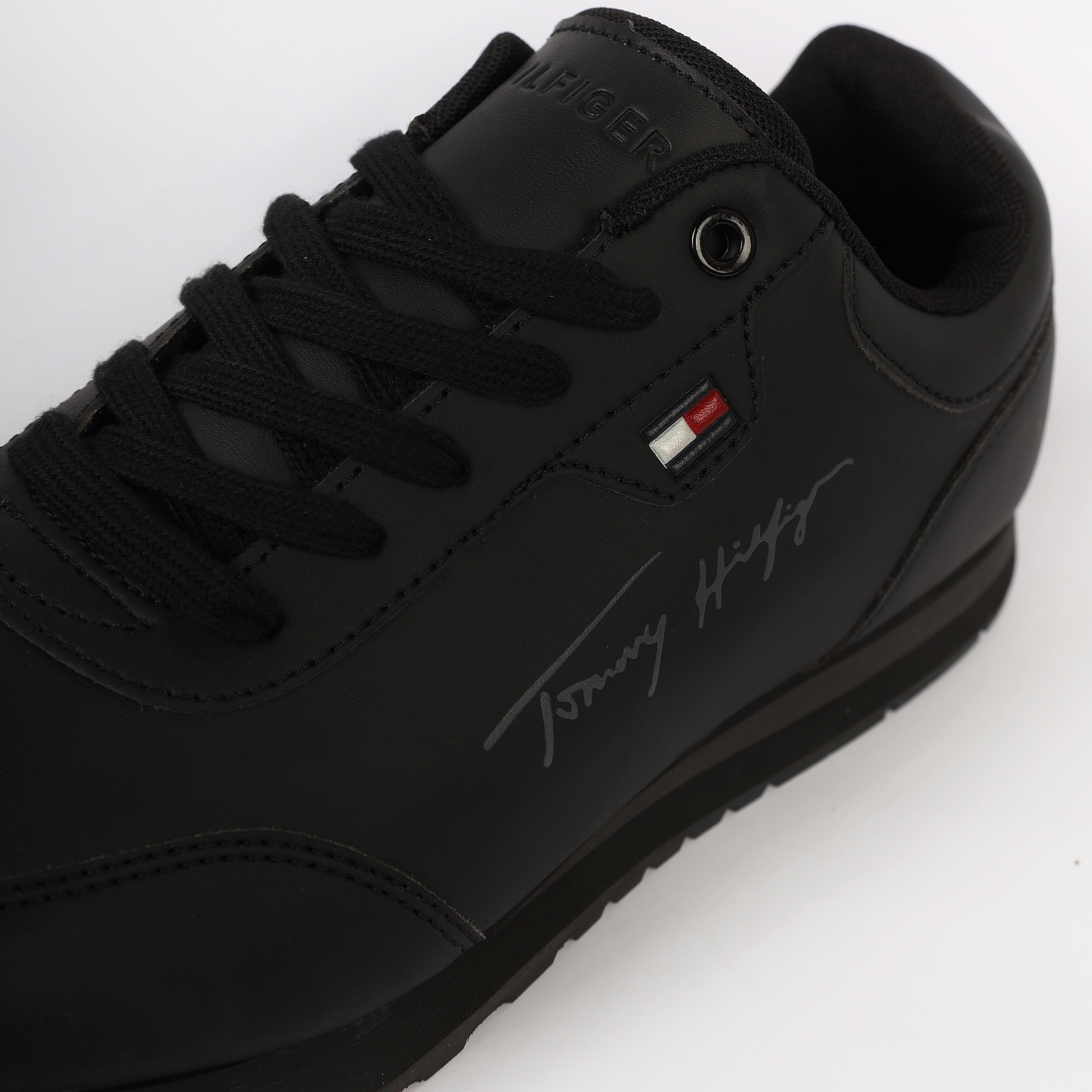 Flag Leather Sneaker" by Tommy Hilfiger. Black